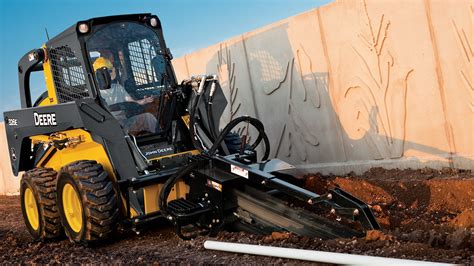 can skid steer dig|john deere digging a ditch.